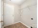 Mud room with tile floor, storage shelf and access door to exterior at 116 Amber Woods Dr, Tega Cay, SC 29708