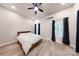 Bright bedroom with hardwood floors, neutral colors, and a ceiling fan at 118 Tayport Dr, Troutman, NC 28166