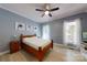 This bright bedroom has beautiful blue accent walls, crisp white trim and natural light at 118 Tayport Dr, Troutman, NC 28166