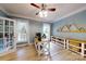 Bright home office with custom wood shelving and a modern desk setup at 118 Tayport Dr, Troutman, NC 28166