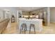 Modern kitchen with light countertops and an island with seating at 118 Tayport Dr, Troutman, NC 28166