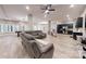 Expansive open living area with hardwood floors, modern lighting, and a neutral color palette at 118 Tayport Dr, Troutman, NC 28166