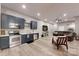 Open-concept living room with modern kitchen, stainless appliances and lots of seating space at 118 Tayport Dr, Troutman, NC 28166