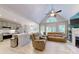 Open-concept living area featuring a kitchen, island, seating area, and high ceilings at 118 Tayport Dr, Troutman, NC 28166