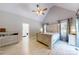 Spacious main bedroom featuring vaulted ceilings, light wood floors and en suite bathroom at 118 Tayport Dr, Troutman, NC 28166