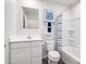 Bright bathroom with a white vanity, framed mirror, and tiled shower-tub combo at 12013 Beaux Art Ln, Charlotte, NC 28214