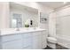 Clean and bright bathroom featuring a double vanity, tub/shower combo, and contemporary finishes at 12013 Beaux Art Ln, Charlotte, NC 28214
