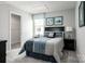 Cozy bedroom with a comfortable bed, neutral walls, and easy access to a walk-in closet at 12013 Beaux Art Ln, Charlotte, NC 28214