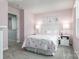 Charming ' bedroom with pink walls, playful decor, and soft carpeting at 12013 Beaux Art Ln, Charlotte, NC 28214