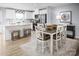 Open-concept kitchen and dining area with a view of the stainless steel appliances and modern decor at 12013 Beaux Art Ln, Charlotte, NC 28214