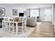 Living area with a dining table, comfortable seating, and bright light at 12013 Beaux Art Ln, Charlotte, NC 28214