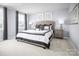 Calm main bedroom with neutral tones, decorative pillows, and bedside lamps at 12013 Beaux Art Ln, Charlotte, NC 28214
