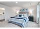 Serene main bedroom with a plush bed, stylish lamps, and tasteful decorations at 12013 Beaux Art Ln, Charlotte, NC 28214