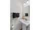 Stylish half-bathroom featuring a pedestal sink, modern fixtures, and minimalist design at 124 Kristin View Ln # C, Troutman, NC 28166