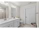 Bright bathroom features double vanity, white cabinets, and tile flooring at 124 Kristin View Ln # C, Troutman, NC 28166