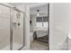Bathroom with a glass door shower and view into the bedroom at 124 Kristin View Ln # C, Troutman, NC 28166