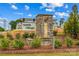 Stone monument sign for Smith Village community surrounded by beautiful landscaping and blue sky at 124 Kristin View Ln # C, Troutman, NC 28166