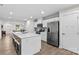 Open-concept kitchen boasting stainless steel appliances, quartz countertops, and a spacious center island with bar seating at 124 Kristin View Ln # C, Troutman, NC 28166