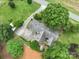 Overhead view of property showcasing the roof, surrounding trees, and driveway access to road at 13101 Pine Bluff Rd, Midland, NC 28107