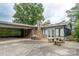 Exterior of home with concrete patio and covered carport at 13101 Pine Bluff Rd, Midland, NC 28107