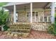 Inviting stone porch with white railing, stone steps, and a well-maintained exterior at 13101 Pine Bluff Rd, Midland, NC 28107
