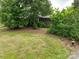 Established front yard featuring a well-maintained lawn and mature trees at 13101 Pine Bluff Rd, Midland, NC 28107