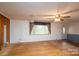 Inviting living room with hardwood floors, featuring a window and entry door at 13101 Pine Bluff Rd, Midland, NC 28107