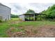 Shot of a rusted silo and an open shed, surrounded by green grass at 13101 Pine Bluff Rd, Midland, NC 28107