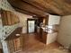Functional kitchen with wooden cabinets, laminate flooring and appliances at 1399 Branton Dr, Iron Station, NC 28080