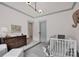A comforting Bedroom with a changing table and white crib, offering a serene space for baby and parent at 14105 Ryker Way, Davidson, NC 28036