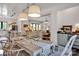 Bright dining room with wood table, stylish chairs, and views of the living room at 14105 Ryker Way, Davidson, NC 28036