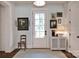 Light and airy entryway featuring dark wood floors, classic rug, and neutral paint at 14105 Ryker Way, Davidson, NC 28036