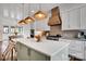 This open kitchen has stone countertops, stainless steel appliances, and island with seating at 14105 Ryker Way, Davidson, NC 28036