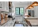 Bright kitchen with shaker cabinets, stainless steel appliances, and pendant lighting at 14105 Ryker Way, Davidson, NC 28036