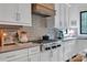 Modern kitchen featuring stainless steel appliances, gray countertops, and a tile backsplash at 14105 Ryker Way, Davidson, NC 28036