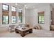 Bright playroom featuring large windows, neutral decor, and cozy seating at 14105 Ryker Way, Davidson, NC 28036