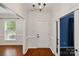 Inviting foyer with hardwood floors, white walls, and natural light from nearby windows at 14616 Pomerol Ln, Pineville, NC 28134