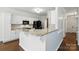 Bright kitchen featuring granite countertops and modern black appliances at 14616 Pomerol Ln, Pineville, NC 28134