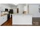 Stylish kitchen with granite countertops and modern black appliances at 14616 Pomerol Ln, Pineville, NC 28134
