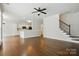 Open living room and staircase with hardwood floors at 14616 Pomerol Ln, Pineville, NC 28134