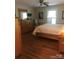 Bright bedroom with a wooden bed frame, dresser, and a window with plantation shutters at 1619 Bellamy Cir, Albemarle, NC 28001