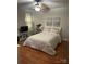 Cozy bedroom featuring a comfortable bed, a TV, and ample natural light from the window at 1619 Bellamy Cir, Albemarle, NC 28001