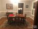 Cozy dining room featuring hardwood floors, a wooden table, and natural lighting at 1619 Bellamy Cir, Albemarle, NC 28001