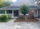 Beautiful brick home with well-maintained landscaping and a covered porch area at 1619 Bellamy Cir, Albemarle, NC 28001