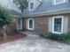 Charming brick home featuring classic shuttered windows and manicured landscaping at 1619 Bellamy Cir, Albemarle, NC 28001