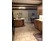 Spacious kitchen showcases wooden cabinetry, tile floors, and a functional center island at 1619 Bellamy Cir, Albemarle, NC 28001