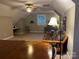 Spacious living room with a ceiling fan, futon and a large wooden table with chairs at 1619 Bellamy Cir, Albemarle, NC 28001
