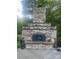 Outdoor stone fireplace offering a cozy and inviting outdoor space at 1619 Bellamy Cir, Albemarle, NC 28001