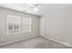 Clean and neutral bedroom with two large windows providing natural light at 18339 The Commons Blvd, Cornelius, NC 28031