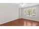 Inviting bedroom with hardwood floors and sunlit with windows and plantation shutters at 18339 The Commons Blvd, Cornelius, NC 28031